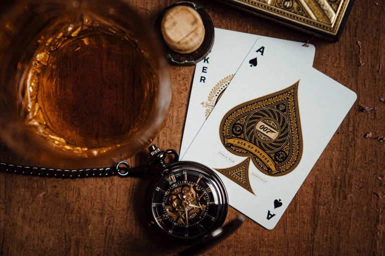 gold pocket watch on white paper