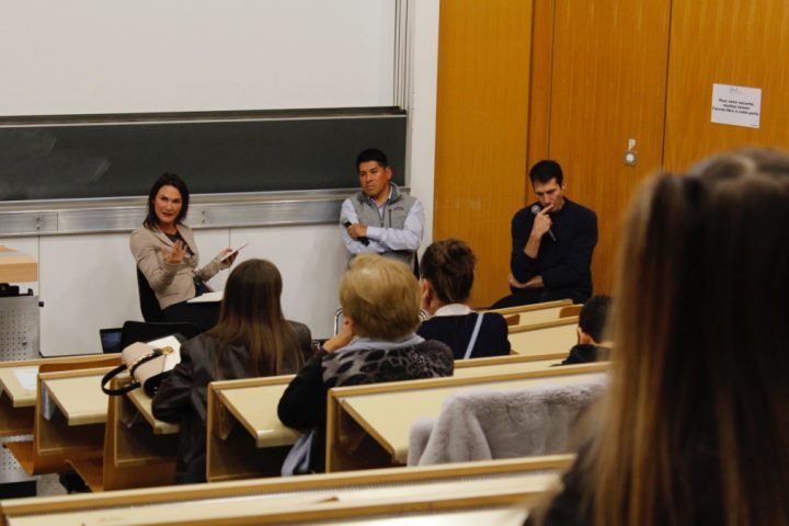 A group of people in a classroom Description automatically generated with medium confidence