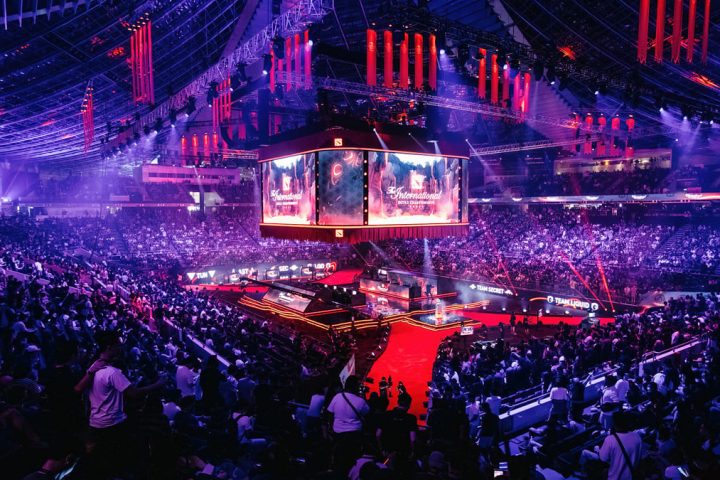 A large crowd of people in a stadium Description automatically generated