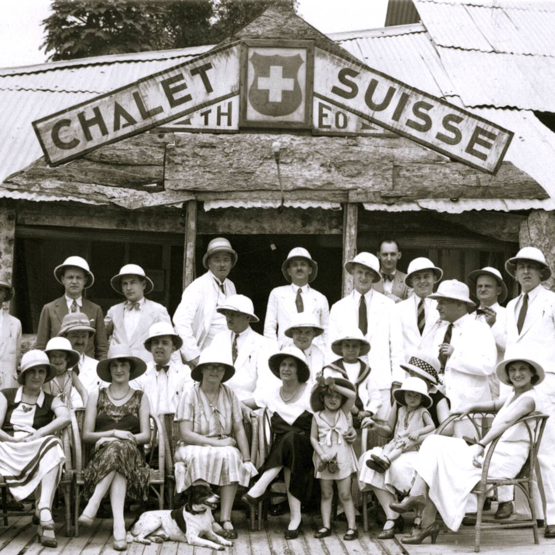 A group of people in white coats and hats

Description automatically generated